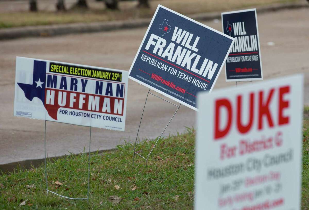 Signs of District G council member candidaes are placed outside Nottingham Park for special election Tuesday, Jan. 25, 2022, in Houston. The Nottingham Park site got high voter turnout in the early vote.