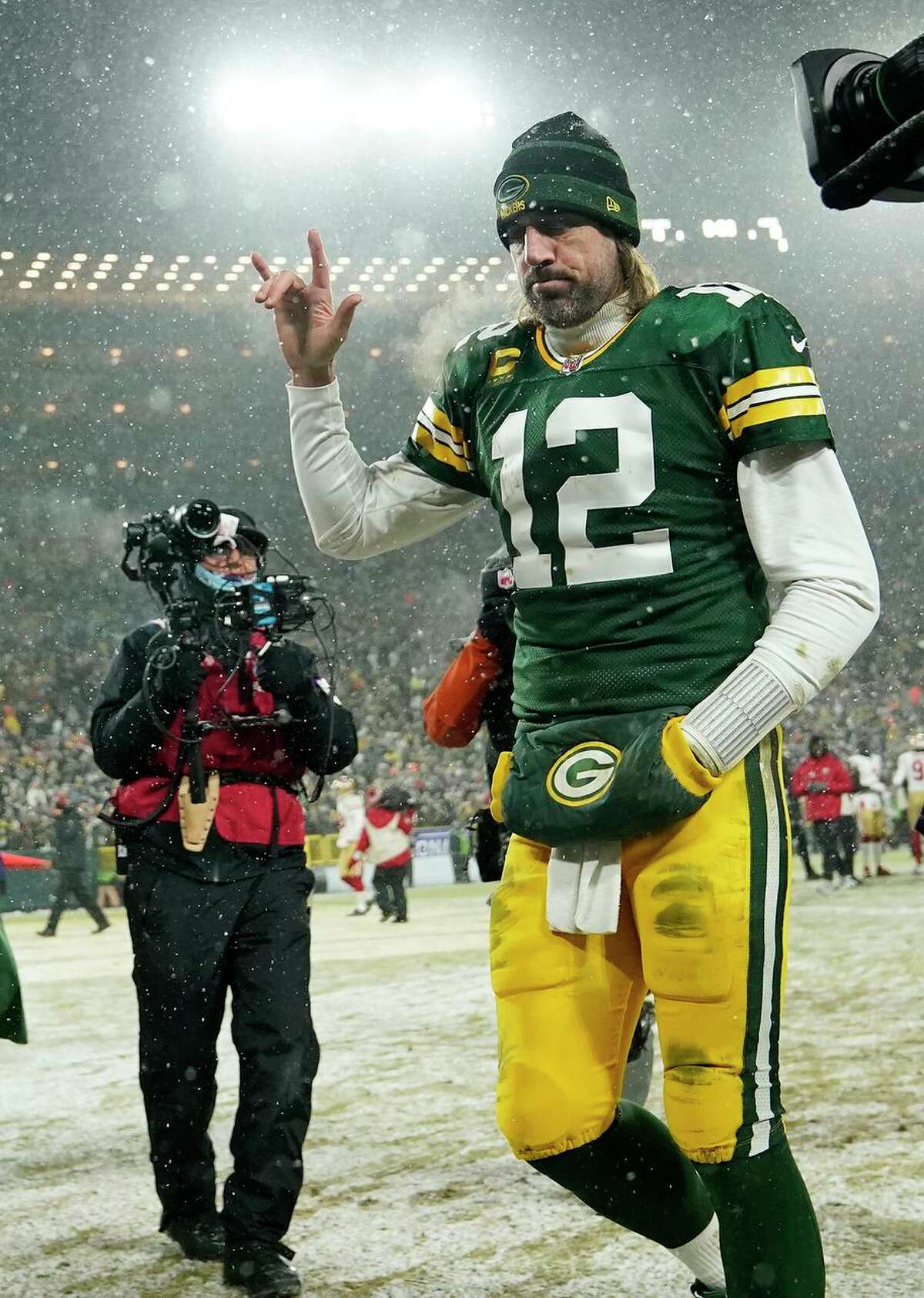 Quarterback Aaron Rodgers departs after the Packers lost their divisional playoff game to the 49ers at Lambeau Field.