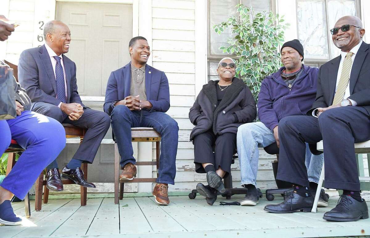 Houston Mayor Sylvester Turner, from left, shares a laugh with EPA Administrator Michael S. Regan, neighbors Doris Brown and Walter Mallett to Dr. Robert Bullard, during a tour of Fifth Ward in Houston on Nov. 19, 2021. Administrator Regan’s stop was part of a week-long trip through Mississippi, Louisiana and Texas to highlight environmental justice concerns, hear from impacted communities and discuss solutions for communities most in need.