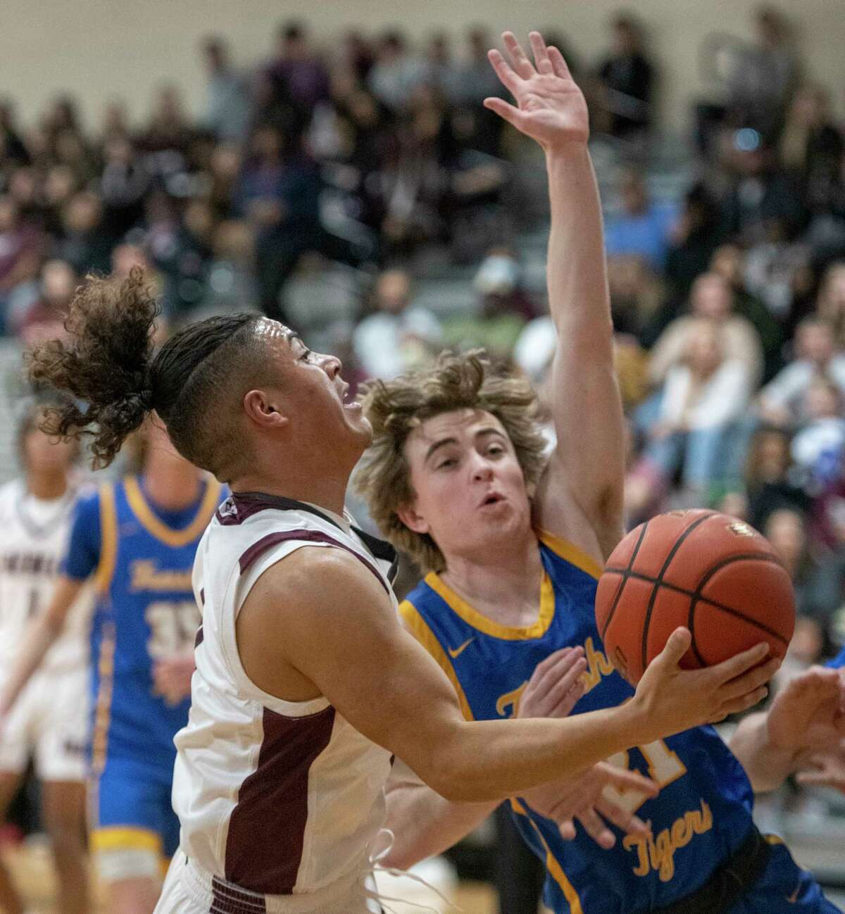 Legacy High's Donny Bishop drives to the basket as he is fouled by Frenship's Dylan Kinsey 01/25/2022 the Legacy High gym. Tim Fischer/Reporter-Telegram