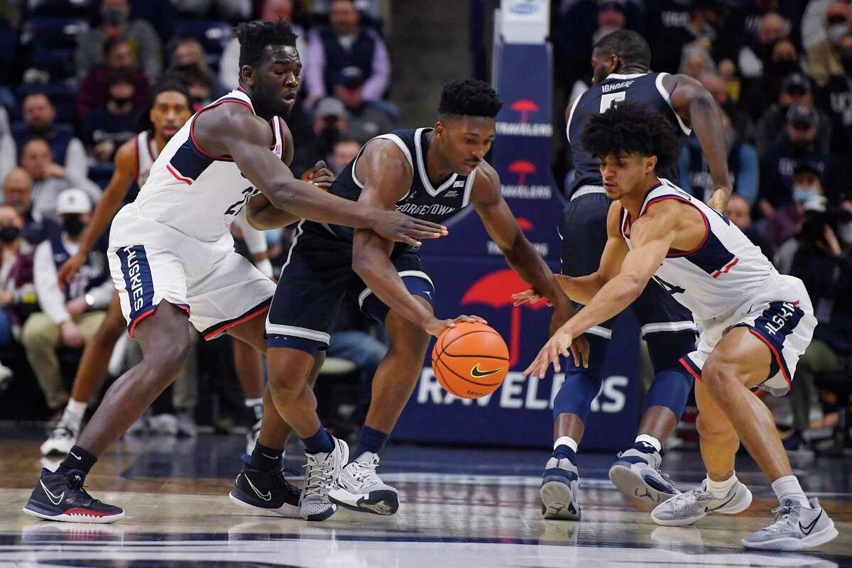 UConn’s Adama Sanogo, left, and Andre Jackson, right, boast NBA potential, but both have plenty still to work on according to NBA scouts.