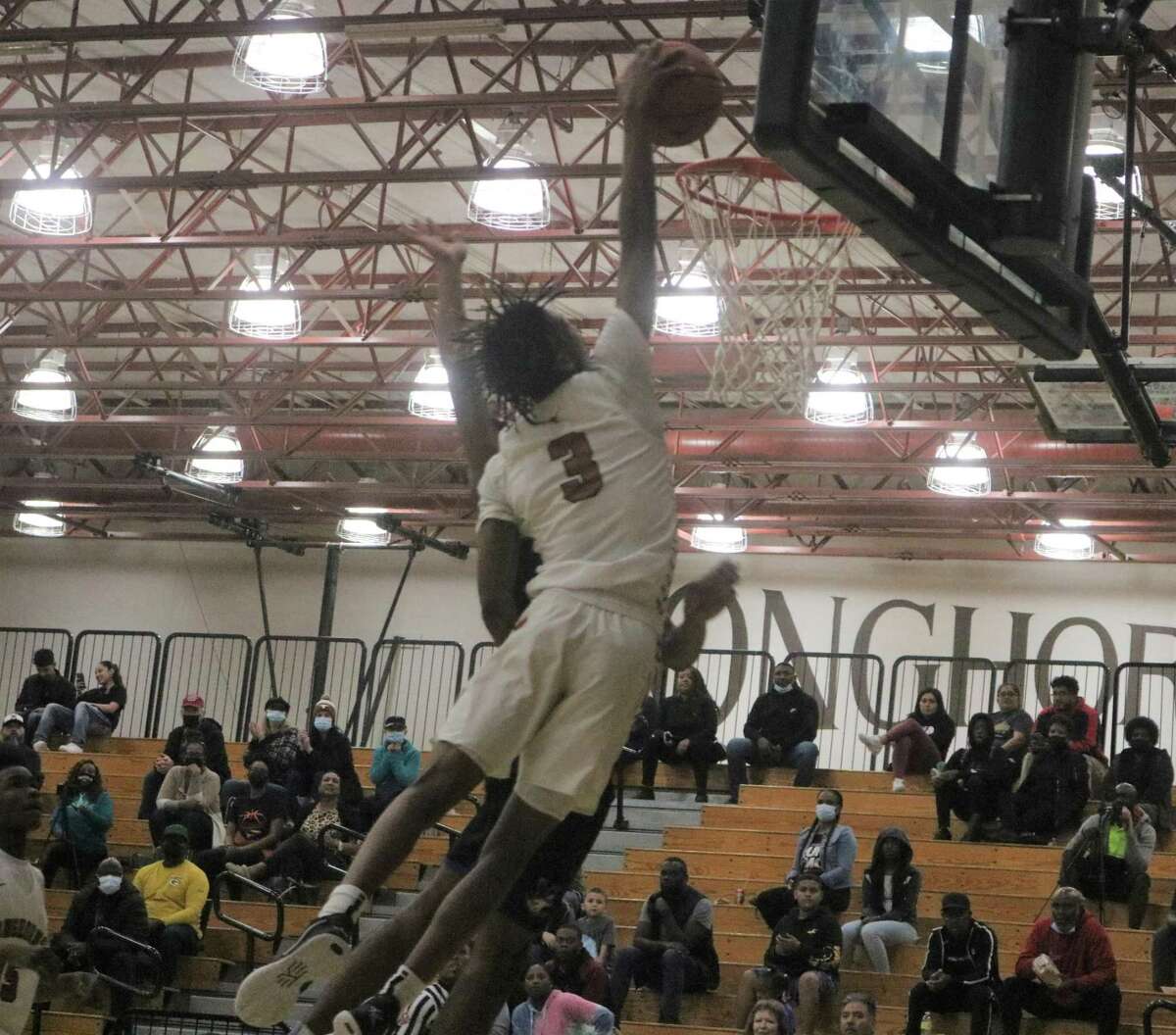 Dobie's Deven Lendsey registers another slam dunk Tuesday night as the senior powered his teammates to an easy victory in a showdown of the district's two hottest teams.