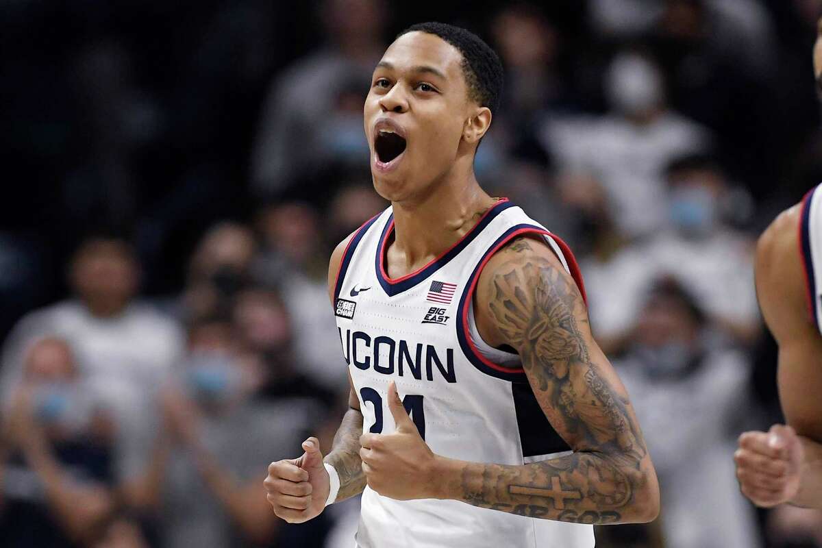 UConn’s Jordan Hawkins reacts in the second half of an NCAA college basketball game against Georgetown, Tuesday, Jan. 25, 2022, in Storrs, Conn.