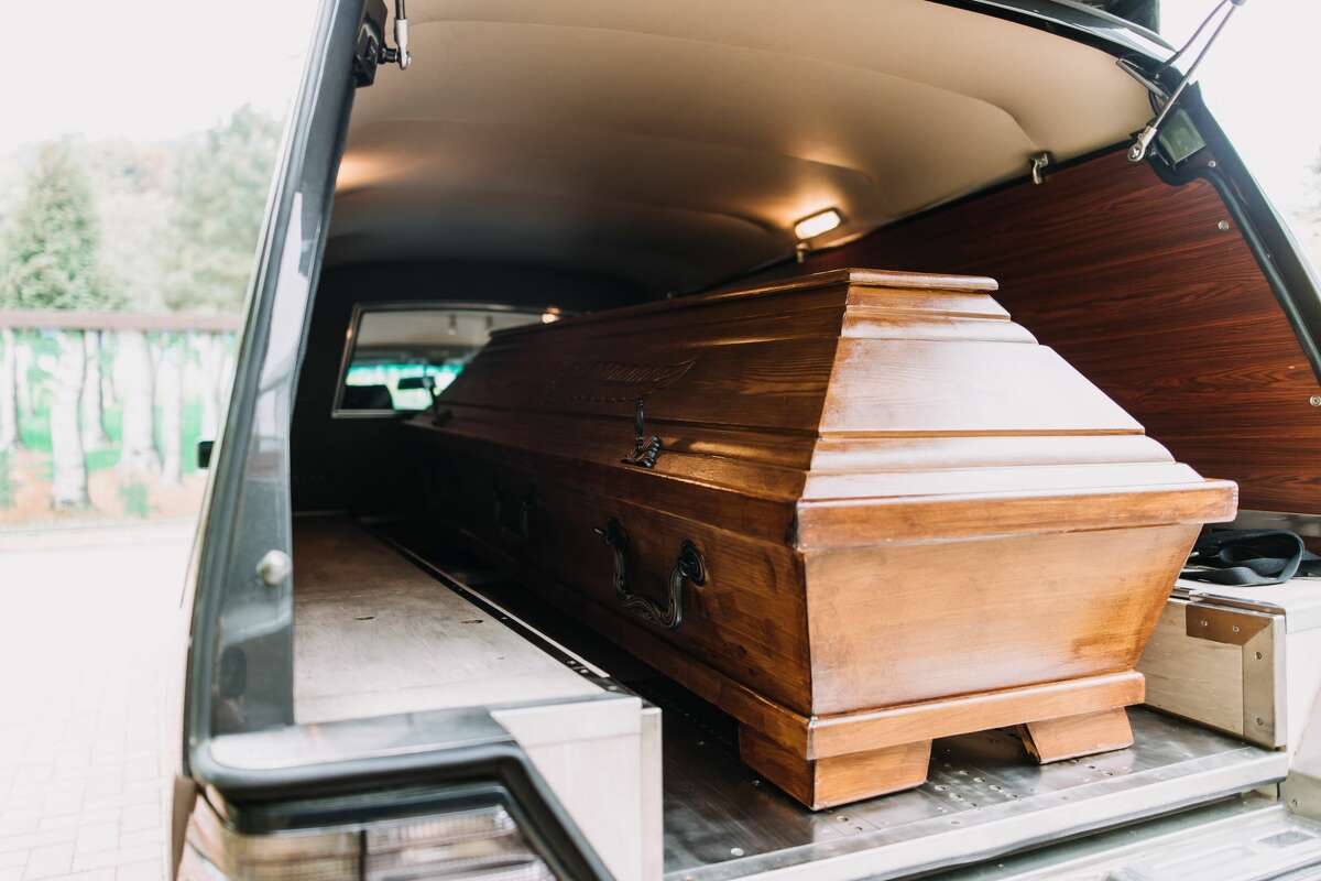 A coffin sits in a vehicle awaiting transport. Stock image: Getty.