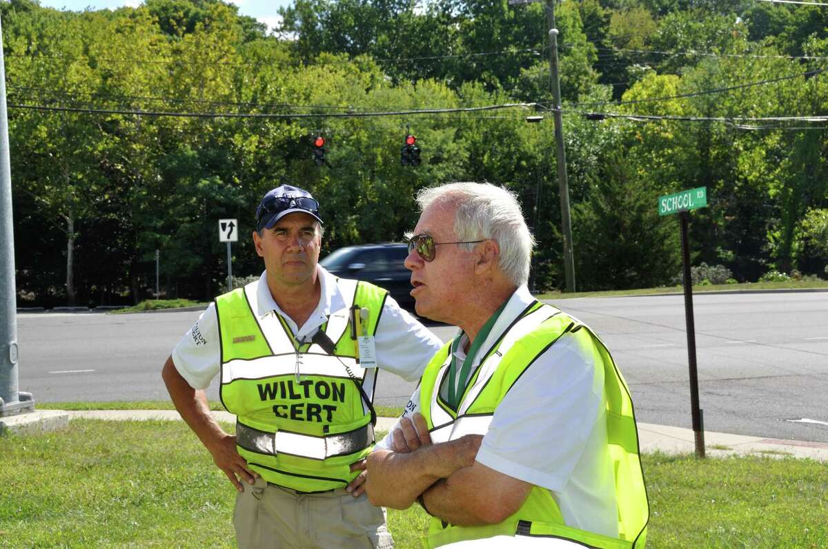 T.G. Rawlins, left, listens as Jack Majesky of Wilton CERT, pictured in 2014, goes over instructions before the annual 9/11 motorcycle caravan in that year. Wilton’s all-volunteer Community Emergency Response Team, in conjunction with the Wilton Emergency Management Director and Wilton Chief of Police John Lynch, has announced its annual disaster preparedness training program.