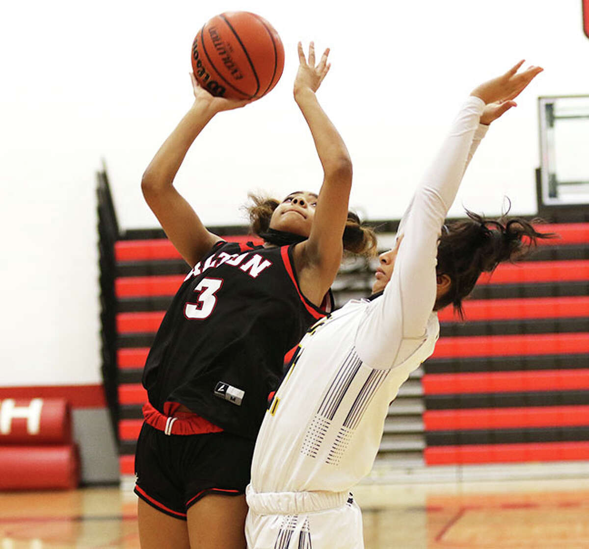 Kiyoko Proctor (left), shown shooting over an O'Fallon defender Saturday at the Highland Tourney, made six 3-pointers and scored a career-high 26 points in Tuesday's win at East St. Louis.