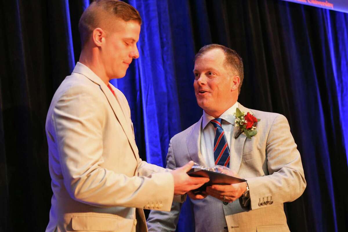 Cody Spence, board member of the Conroe/Lake Conroe Chamber of Commerce, left, receives the Horizon Award from Chairman Matt Davis during the Chairman’s Ball, Jan. 27, 2018, at La Torretta Lake Resort and Spa. Spence will be the incoming Chamber Chairman for 2022.