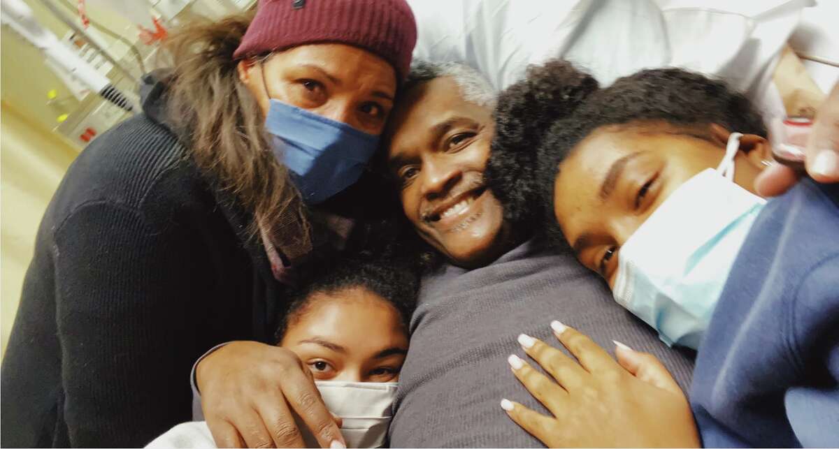 Taken at his hospital bed, this was the last family photo beloved community leader Warren Mackey was able to be in with wife Denyse and his two daughters. He died the next day. Warren was a gifted singer, a youth sports coach, a mentor to many kids and a church leader. He was over 6 feet tall with a big, joyful personality to match his robust physical presence. He was on waiting list for a heart transplant. Now, his widow is teaming up with 17 local churches to get life saving info to the Black community about heart health, transplants and cancer screenings.