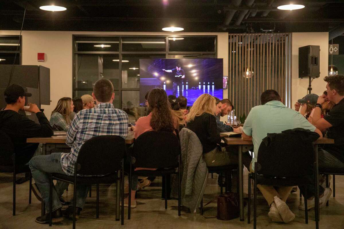 Scenes from the first Porch church service on Tuesday, Jan. 25, 2022 at Second Story Coworking. About 70 young professionals attended the first Porch Live service which provides a ministry opportunity for young adults wanting to connect. Jacy Lewis/Reporter-Telegram
