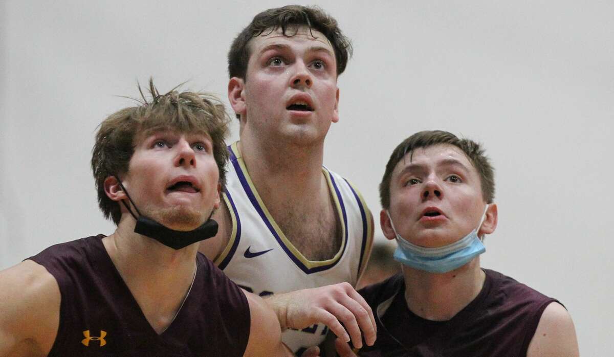 Routt's Gus Abell jockeys for rebounding position during a boys' basketball game against Griggsville-Perry Saturday night.