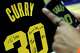 Cal’s Jayda Curry takes a photo of the autographed jersey given to her by the Warriors’ Stephen Curry.