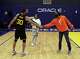 Jayda Curry watches as her coach Charmin Smith shakes hands with Stephen Curry, whose number Jayda wears while playing at Cal after the Golden State Warriors played Dallas Mavericks at Chase Center in San Francisco, Calif., on Tuesday, January 25, 2022.