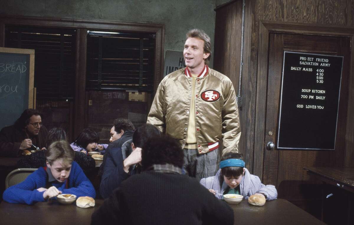 San Francisco 49ers star Joe Montana appears in a Saturday Night Live sketch titled "United Way Commercial" on Jan. 24, 1987, sporting the now-coveted gold satin 49ers jacket.