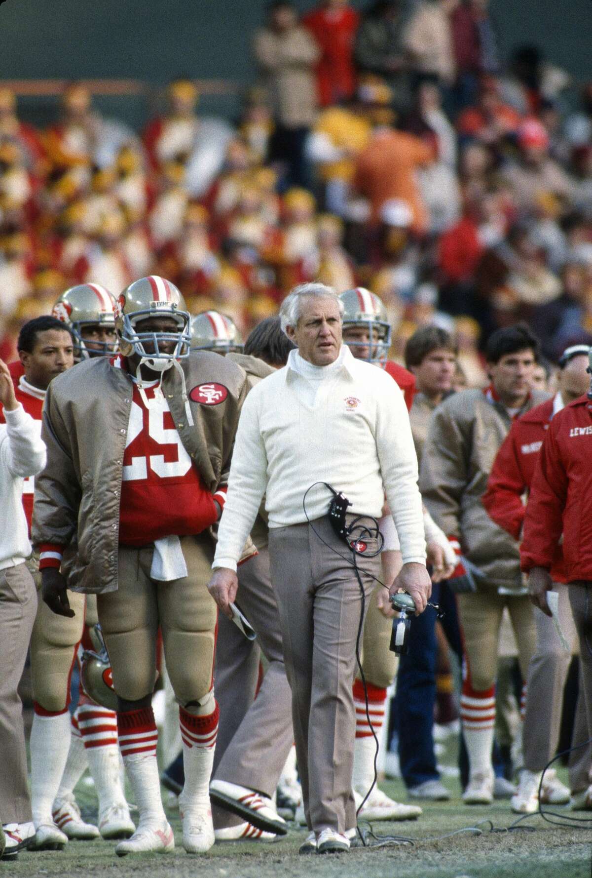 Head coach Bill Walsh of the San Francisco 49ers looks on from the sidelines during an NFL game at Candlestick Park circa 1983 in San Francisco.