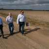 Howard Cohen, Bill Jameson, and The George Foundation CEO Roger Adamson walk across land owned by the foundation along FM 762 on Jan. 6, 2022, near Richmond. Segment C of the Grand Parkway would one day pass through the area, but exactly where remains a point of contention with landowners.