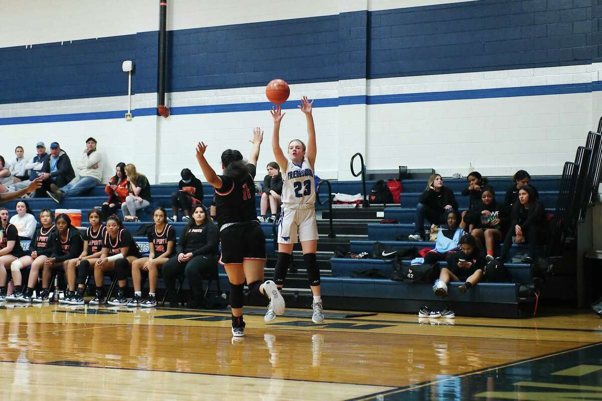 Friendswood’s Helen Byrd (23) puts up a shot over La Porte’s Keely Cummings (11) Tuesday at Friendswood High School.