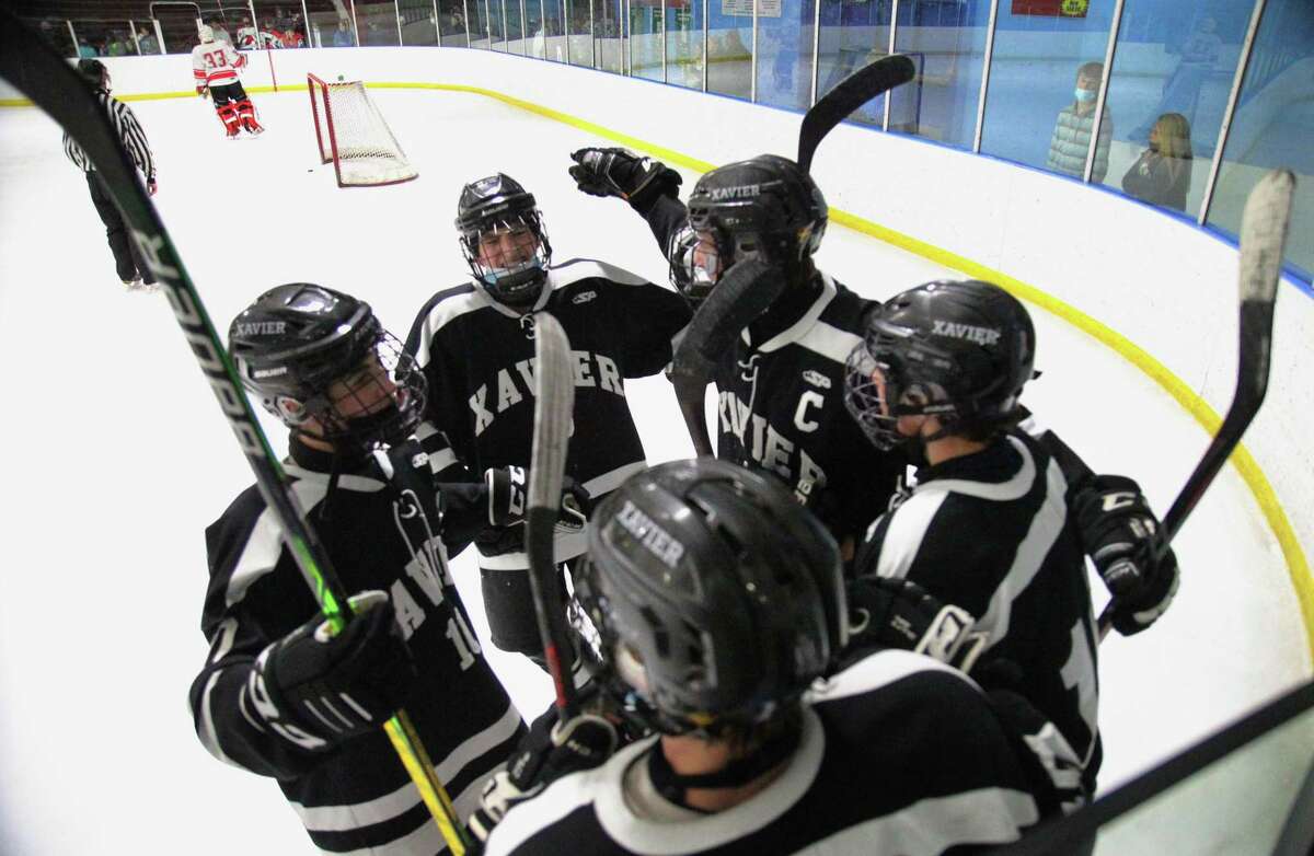 Xavier celebrates a fourth goal against Fairfield Prep during hockey action at Wonderland of Ice in Bridgeport, Conn., on Wednesday January 26, 2022.