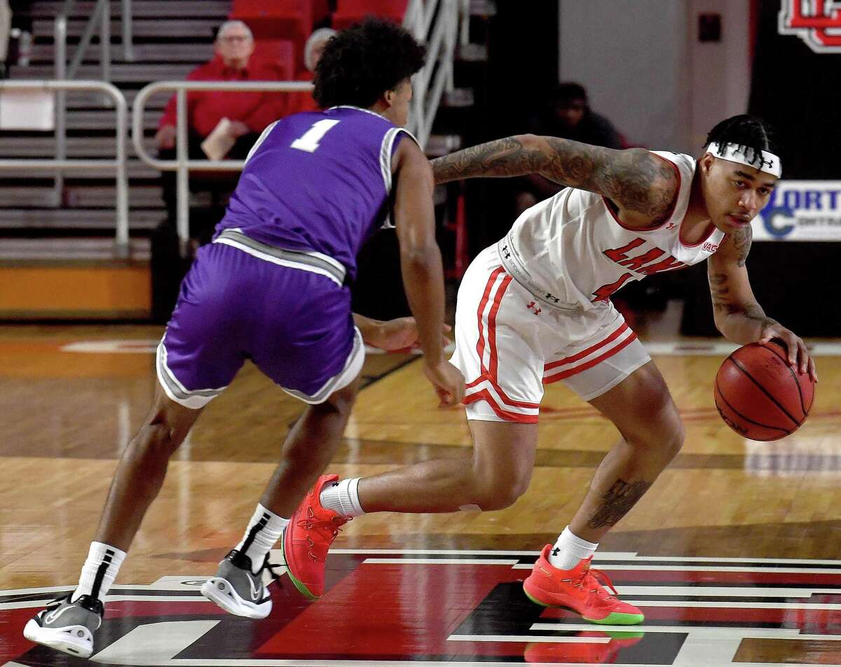Lamar's Kasen Harrison drives past Tarleton State's Noah McDavid during their game at the Montagne Center Wednesday. Photo made Wednesday, January 26, 2022 Kim Brent/The Enterprise