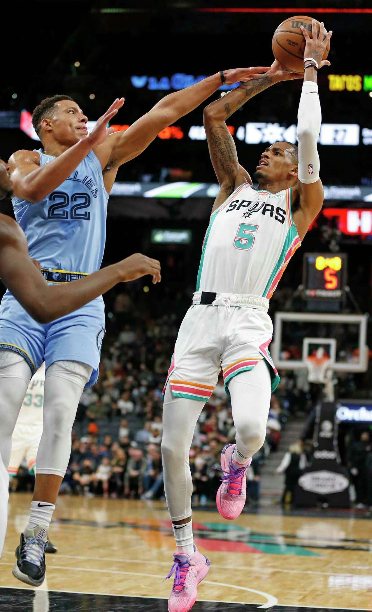 San Antonio Spurs guard Dejounte Murray #5 gets a one and as he is fouled by Memphis Grizzlies Desmond Bane #22 . Spurs-Grizzlies on Wednesday, Jan. 26, 2022 at the Alamodome.