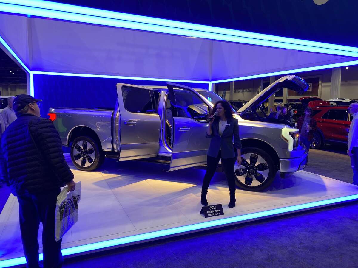 Featured prominently in the center of the Ford display, the 2022 Ford Lightning drew crowds of onlookers with its futuristic aesthetics including an engine-less "frunk."