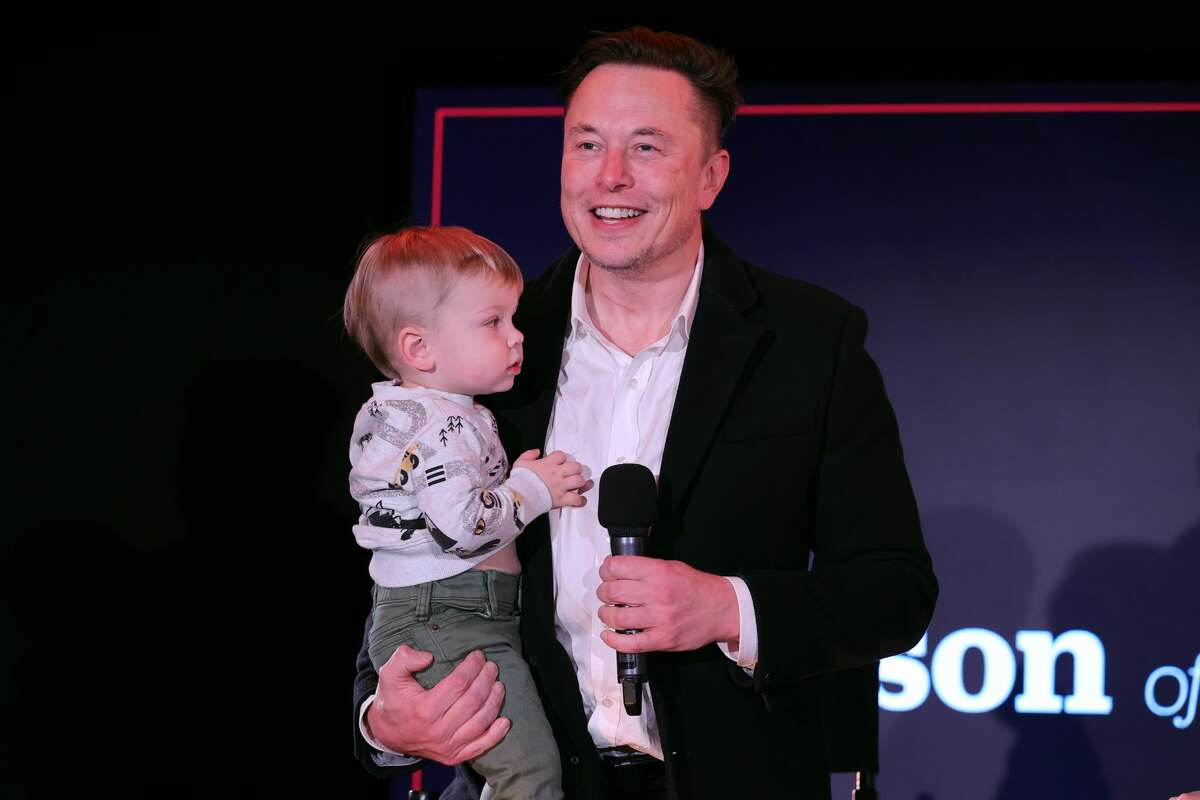 Elon Musk and son are seen on stage during TIME Person of the Year event in New York City on Dec. 13, 2021. 