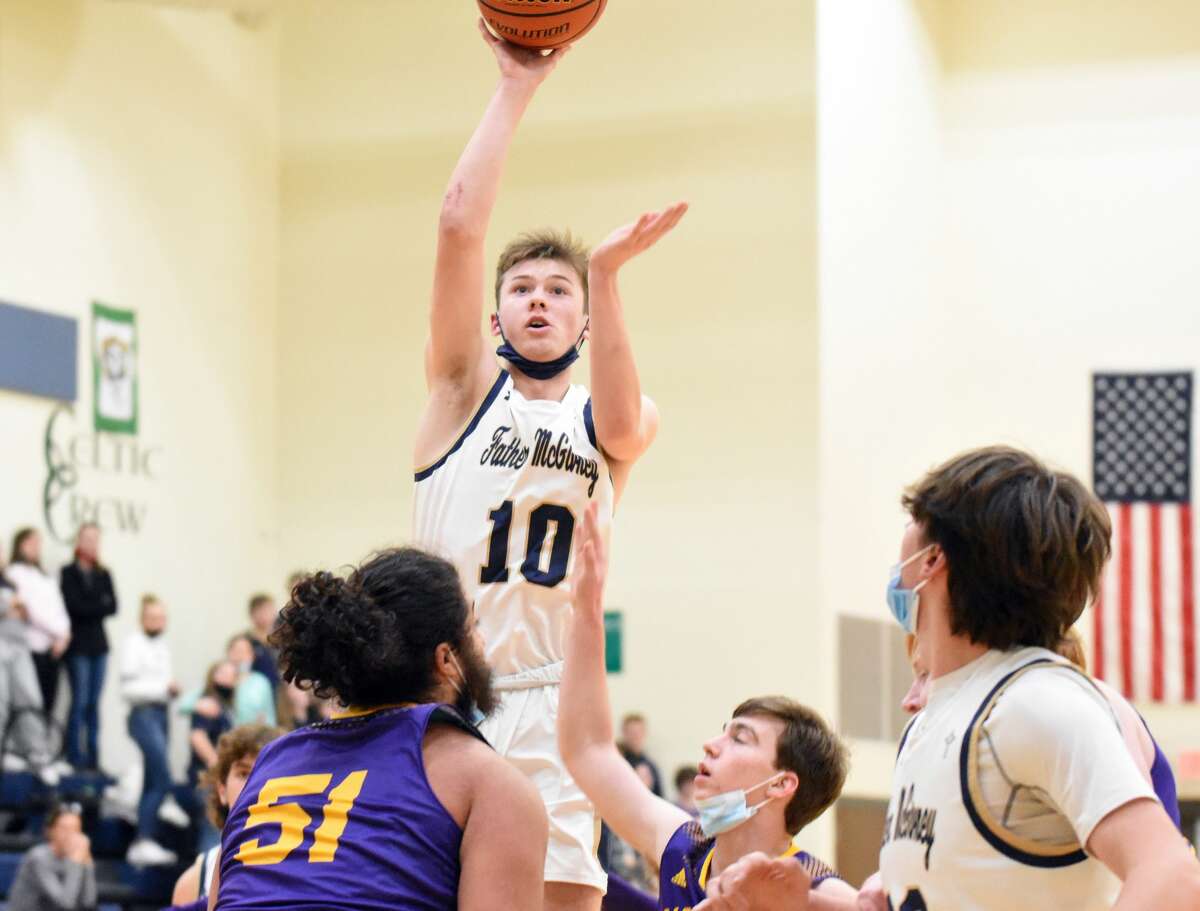 Father McGivney's Jackson Rodgers puts up a jump shot from the elbow against Valmeyer during the first quarter in Glen Carbon.