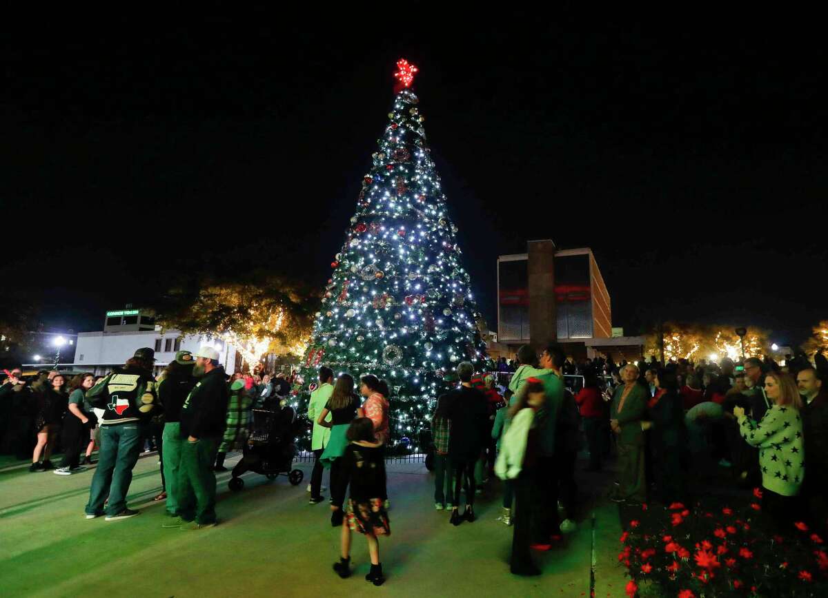 Spectators gather around a Christmas tree during the Conroe Christmas Tree Lighting event in Heritage Park, Tuesday, Nov. 30, 2021, in Conroe. This year’s Christmas tree lighting is set for 6:30 p.m. Nov. 29.