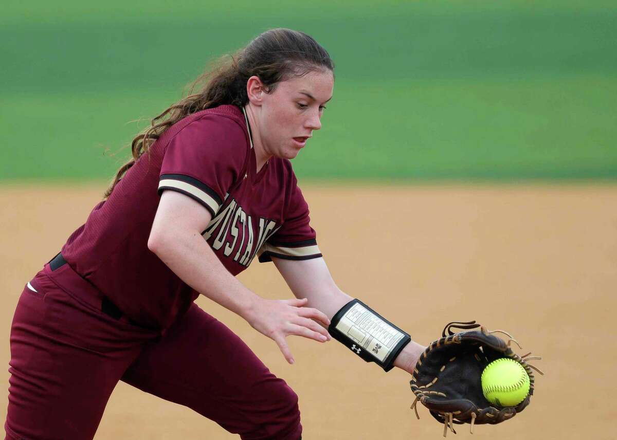 Magnolia West third basman Haleigh McDonald (5) fields a ground ball during the second inning in Game 2 of a Region III-5A bi-district softball series at Grand Oaks High School, Friday, April 30, 2021, in Spring.