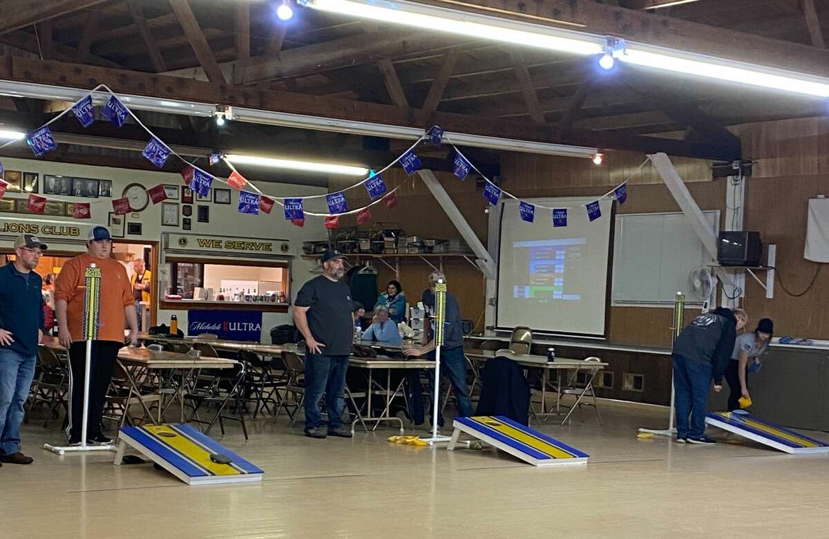Competitors take part in a weekly cornhole league going on at the Onekama Lions Club Den. The competition is still open for members of the public to join in.  
