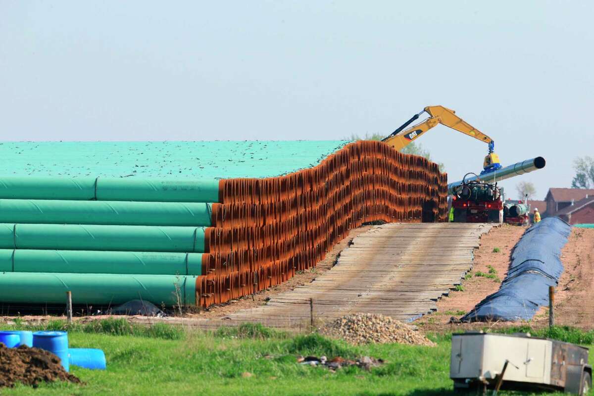 Pipes for the proposed Dakota Access oil pipeline, that would stretch from the Bakken oil fields in North Dakota to Patoka, Ill., are stacked Saturday, May 9, 2015, at a staging area in Worthing, S.D.