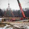 Construction work continues on a temporary bridge near Sanford Dam Thursday, Jan. 27, 2022.