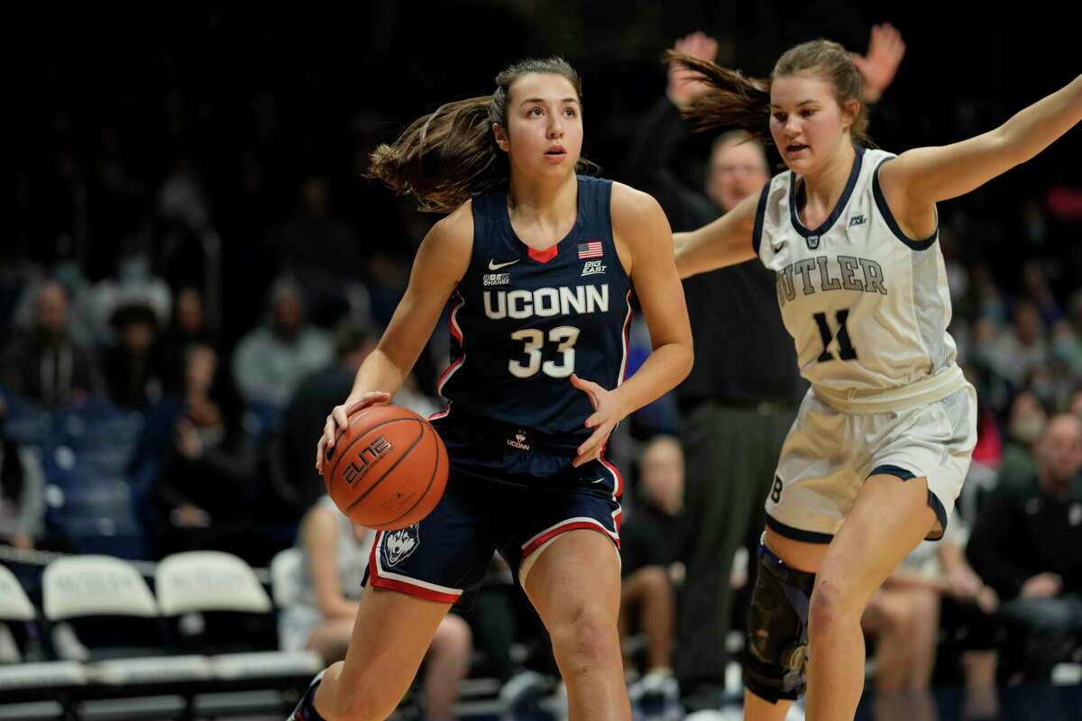 UConn guard Caroline Ducharme (33) in action during the first half of an NCAA college basketball game between Butler and UConn in Indianapolis, Wednesday, Jan. 12, 2022. (AP Photo/AJ Mast)