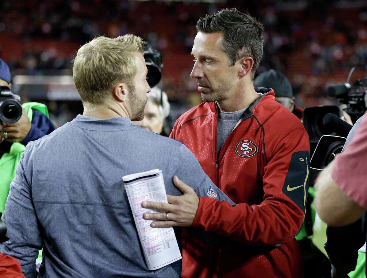 FILE - In this Sept. 21, 2017 file photo Los Angeles Rams coach Sean McVay, left, greets San Francisco 49ers coach Kyle Shanahan after an NFL football game in Santa Clara, Calif.)