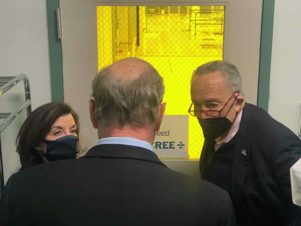 New York Gov. Kathy Hochul and Schumer with Doug Grose, the chair of the board that oversees Albany Nanotech. Grose was showing Hochul and Schumer the space where Wolfspeed developed its manufacturing line before moving it to Utica at its new factory there.