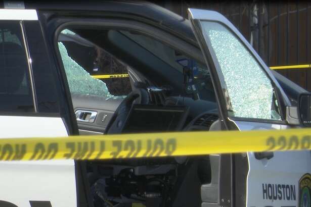 Shattered windows are seen on a Houston police cruiser after three cops were shot in Third Ward on Thursday, Jan. 27, 2022. 