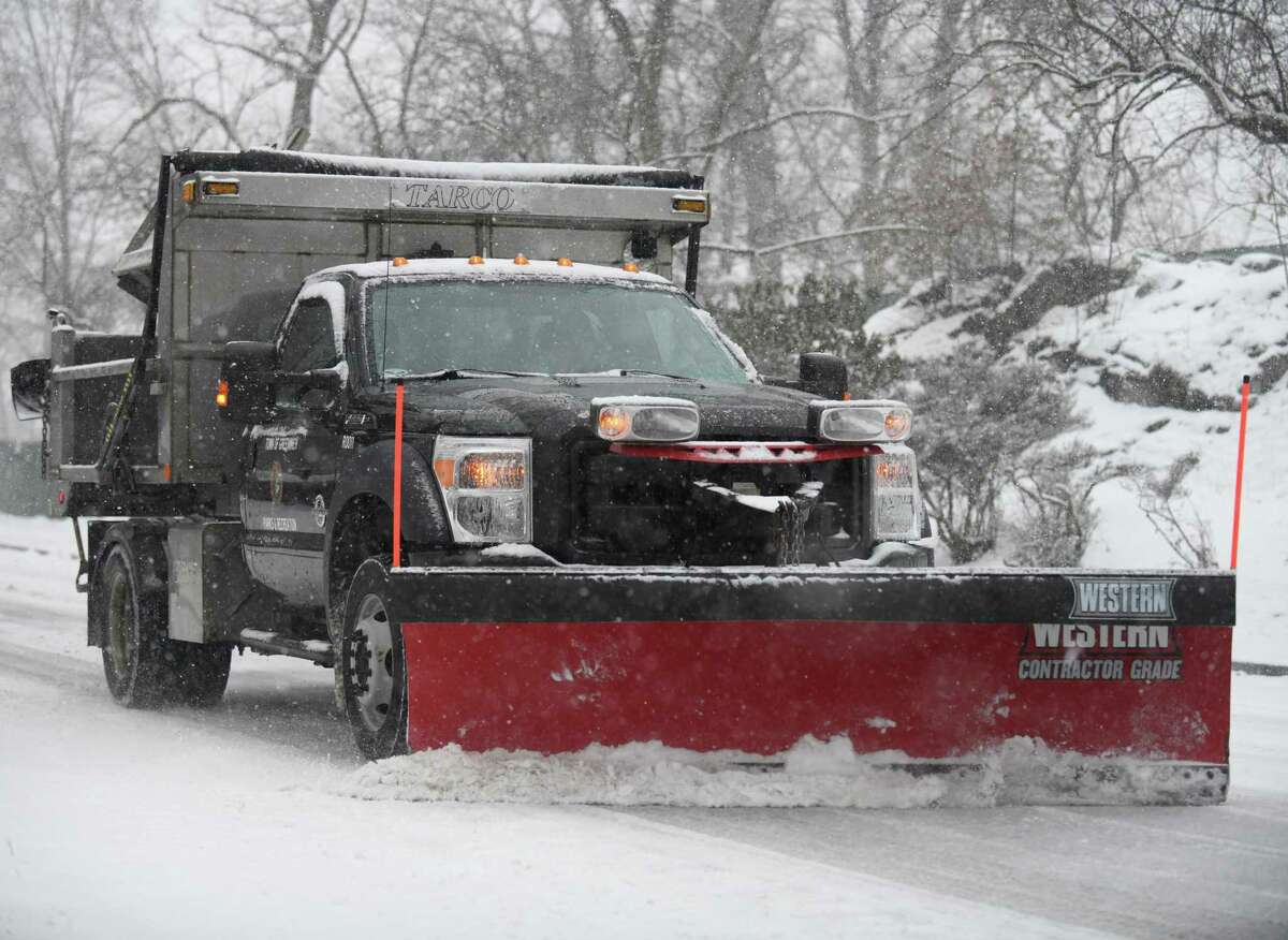 A plow clears snow near the Bruce Museum in Greenwich in February 2021.