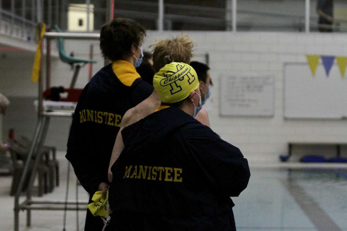 The Chippewas boys swim team stands for the national anthem prior to their swim meet against Fremont in this file photo. 