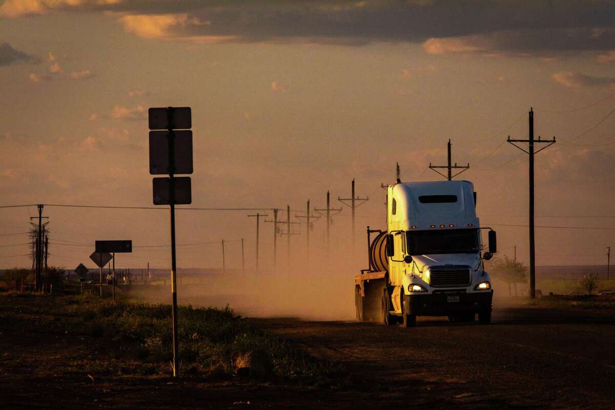 A tractor-trailer hauling liqiud from oil and gas operations in the Permian Basin. Shale companies operating in earthquake-prone areas of West Texas could pay at least $207 million more to transport large volumes of saltwater produced from oil wells to distant disposal sites