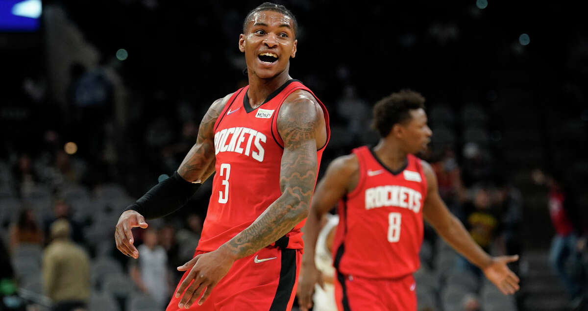 Houston Rockets guard Kevin Porter Jr. (3) celebrates a score against the San Antonio Spurs during the second half of an NBA basketball game, Wednesday, Jan. 12, 2022, in San Antonio. (AP Photo/Eric Gay)