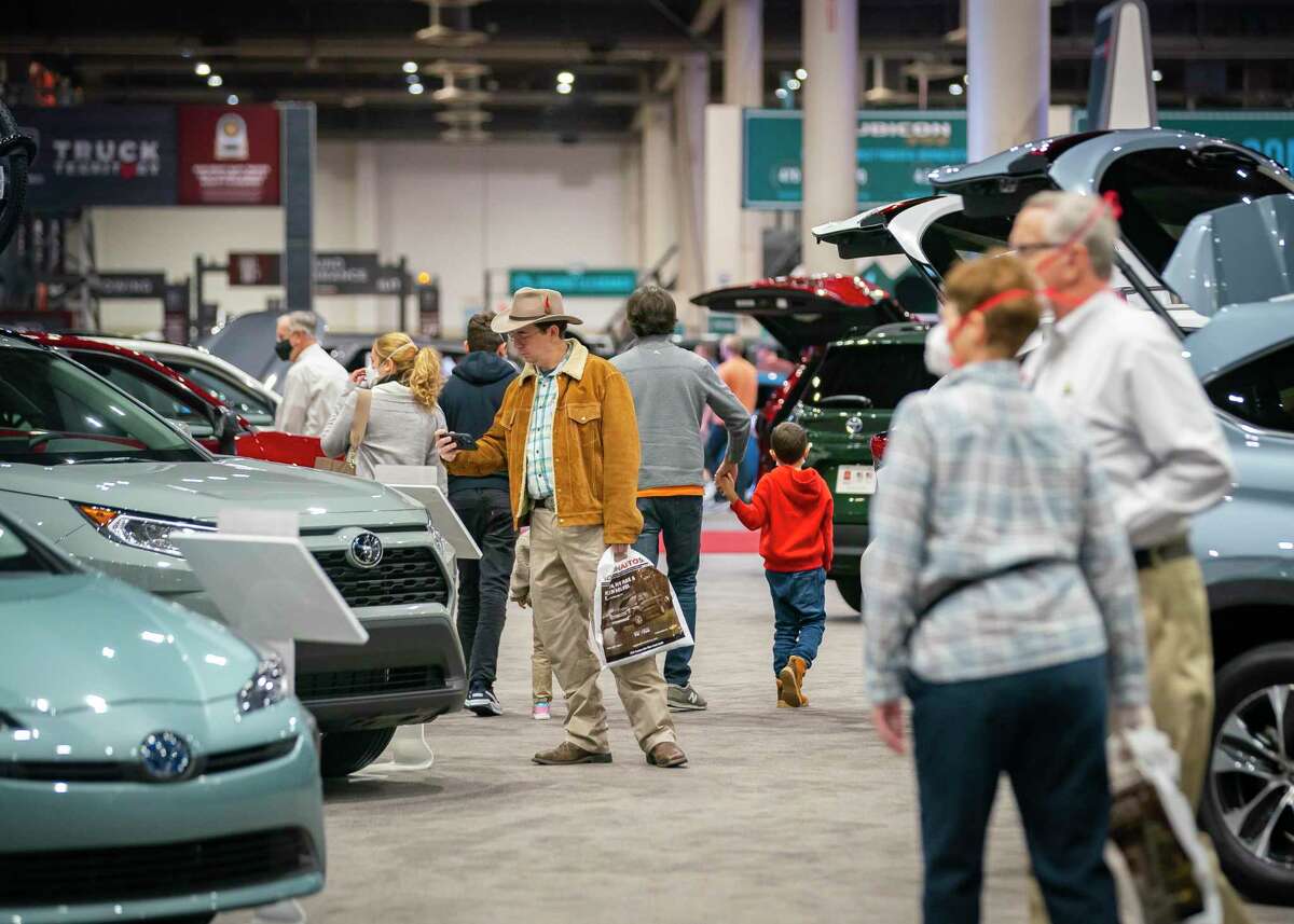 The Houston AutoBoative Show will be held at NRG Center January 25-29. A file photo shows people looking at the new Toyotas on display last year at the combined Houston Boat Show and Houston Auto Show in 2022.