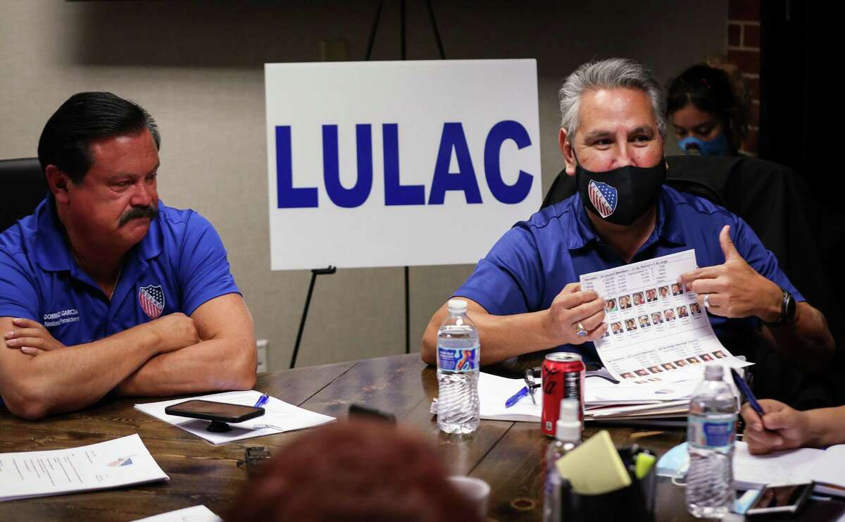 Sergio Lira talks about Latino representation on Houston City Council during a LULAC meeting as Domingo Garcia, LULAC’s national president, listens Tuesday, Jan. 11, 2022, at Garcia’s law office in Houston.