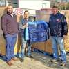 Ocean State Job Lot recently donated coats to veterans organizations around the state. Pictured are Zack Briggs, district manager for ADP; Brian Gates, founder of Bookwell Travel and David Sarlitto, executive director of OSJL Charitable Foundation.