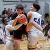 Niskayuna guard Sam Booth grabs a rebound between Christian Brothers Academy sophomore Oreoluwapo Odutayo during a Suburban Council matchup at CBA in Colonie, NY, on Thursday, Jan. 27, 2022. (Jim Franco/Special to the Times Union)