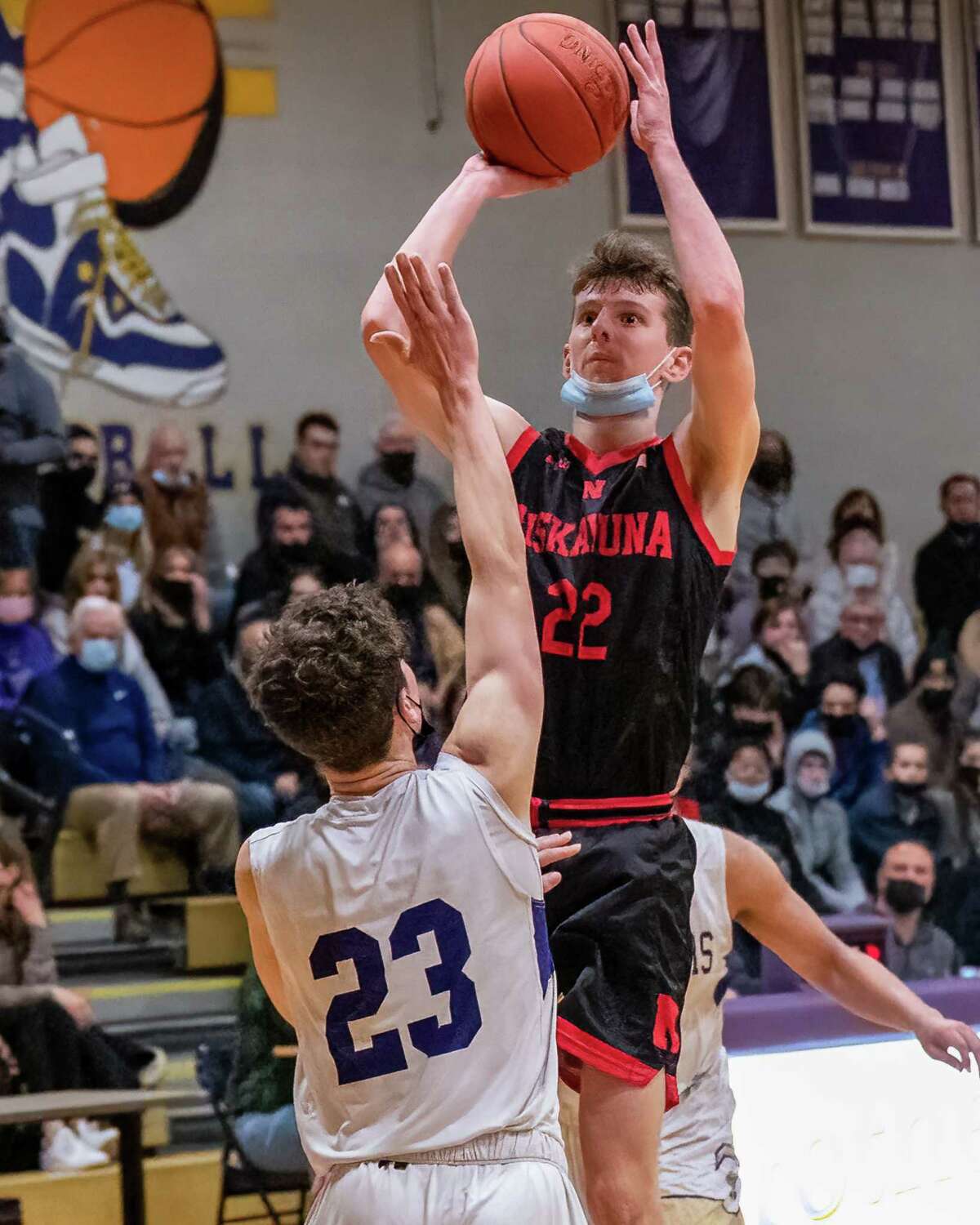 Niskayuna forward Owen Evans takes a jumper over Christian Brothers Academy sophomore Matthew Sgambati during a Suburban Council matchup at CBA in Colonie, NY, on Thursday, Jan. 27, 2022. (Jim Franco/Special to the Times Union)