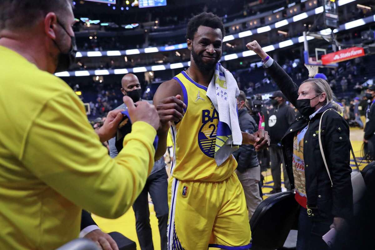 Golden State Warriors' Andrew Wiggins smiles as he leaves the court after 124-115 win over Minnesota Timberwolves during NBA game at Chase Center in San Francisco, Calif., on Thursday, January 27, 2022.