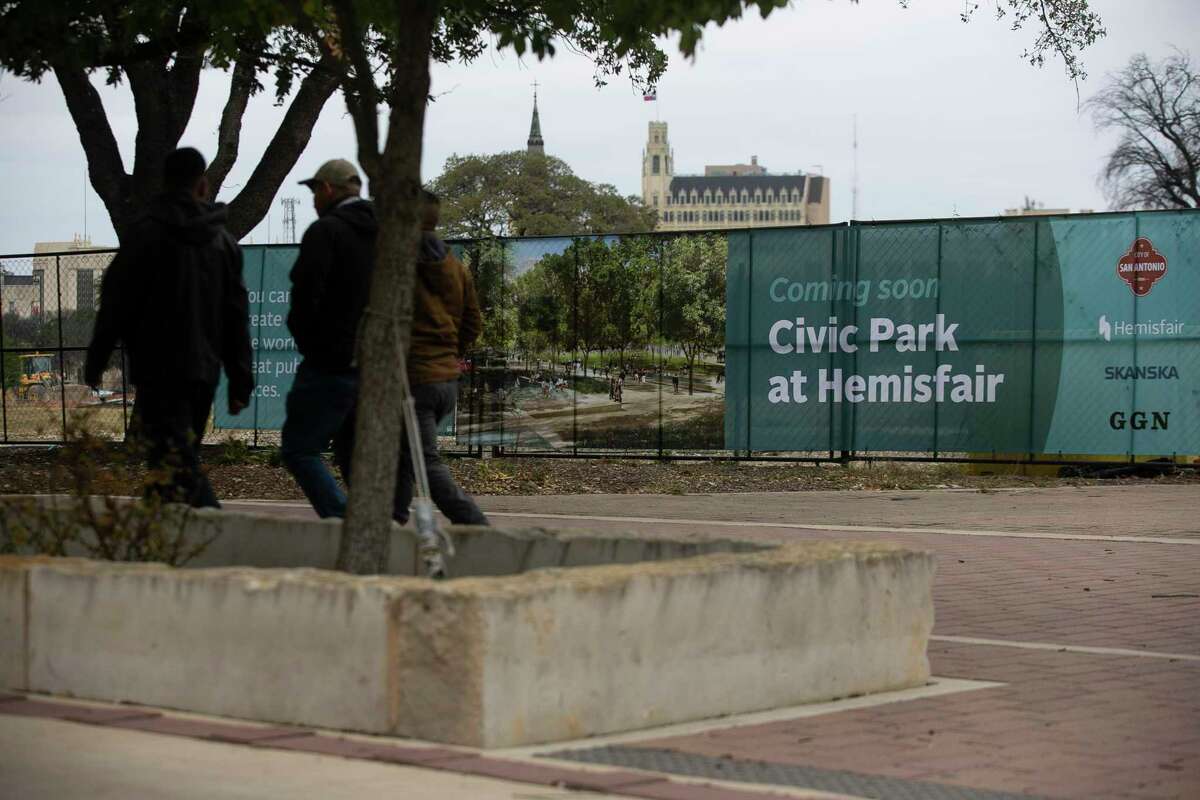 People walk past the future Civic Park at Hemisfair Park in San Antonio, Texas, on Jan. 26, 2022.
