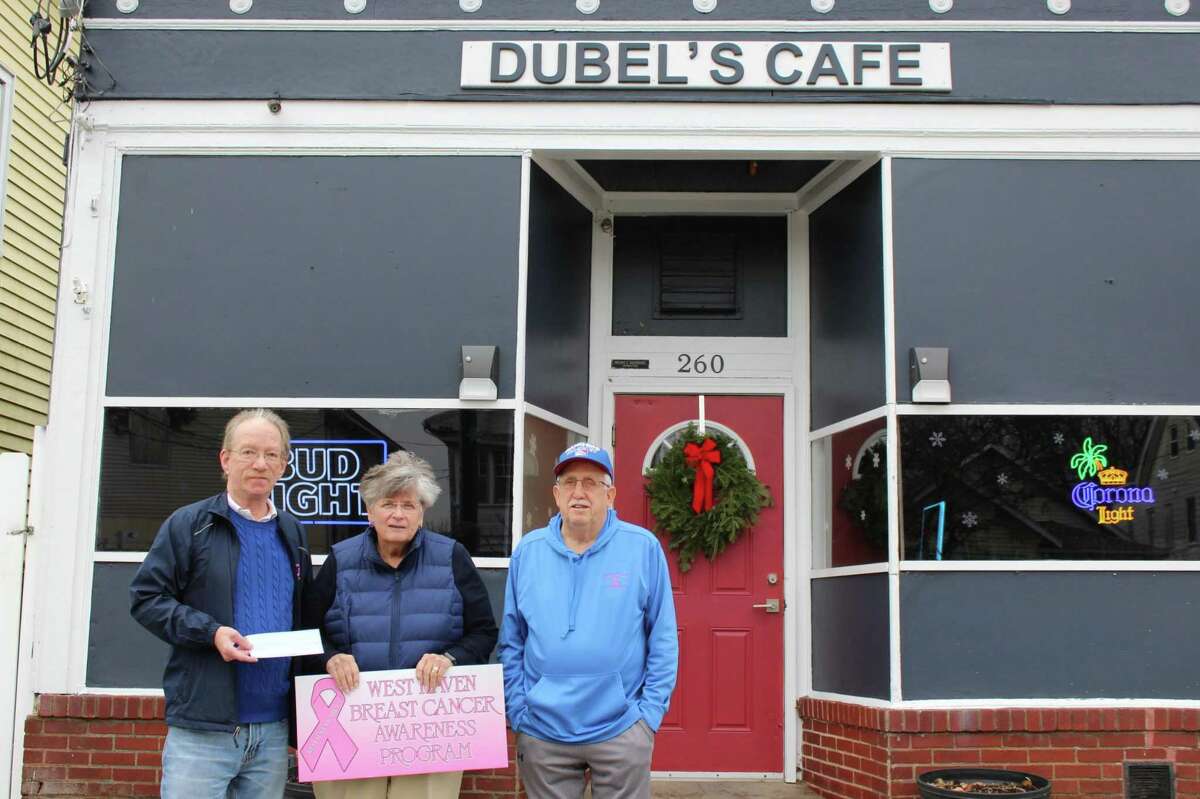 Dubel’s Cafe owner Fred Hugendubel, left, and Art Gilbert, the co-chairmen of the Dubel’s Golf Tournament, present an $8,100 check for the West Haven Breast Cancer Awareness Program to committee member Beth A. Sabo outside Dubel’s at 260 Campbell Ave. Dec. 6. The money was raised at the tournament in October and will benefit the program’s Susan A. Ruickoldt Scholarship Fund. The fund was founded 19 years ago in memory of Ruickoldt, a city schoolteacher who died of breast cancer in 1997, and a $2,000 check is awarded to a female high school senior from West Haven who plans to continue her education.