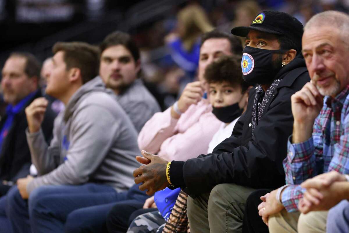 NEWARK, NJ - DECEMBER 01: Kyrie Irving of the Brooklyn Nets watches the action between the Wagner Seahawks and the Seton Hall Pirates of a game at Prudential Center on December 1, 2021 in Newark, New Jersey. Seton Hall defeated Wagner 85-63. (Photo by Rich Schultz/Getty Images)