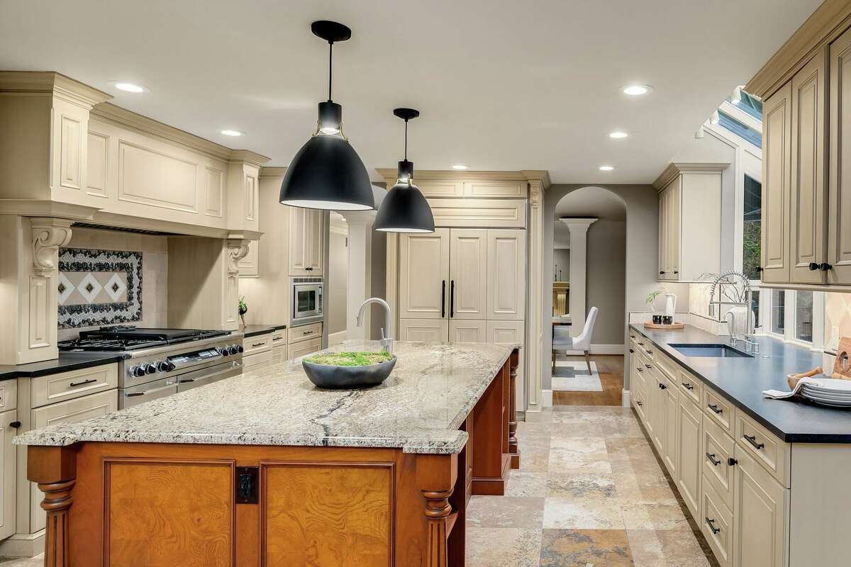 There is a very modern kitchen for a modern buyer.
