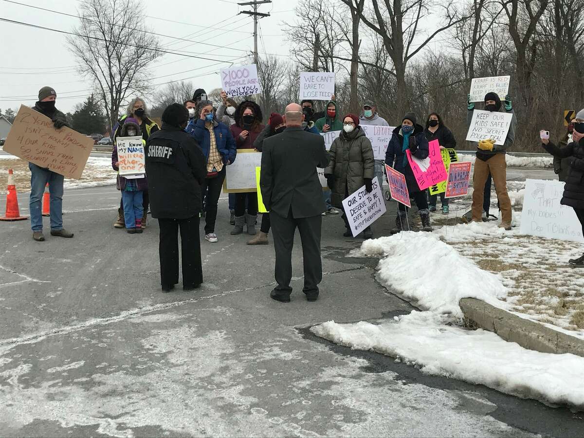 Columbia County Sheriff Don Krapf and Undersheriff Jackie Salvatore answer the questions of protestors rallying against the abrupt transfer of a school resource deputy on Friday, January 28,